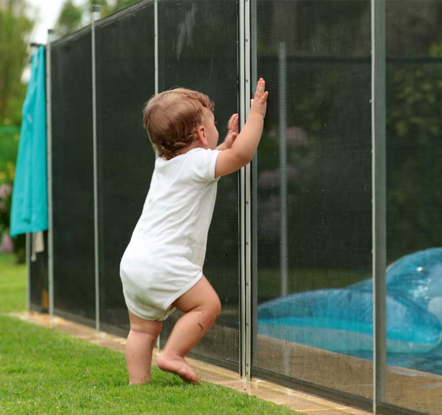 Toddler In Front of St Petersburg Pool Fence